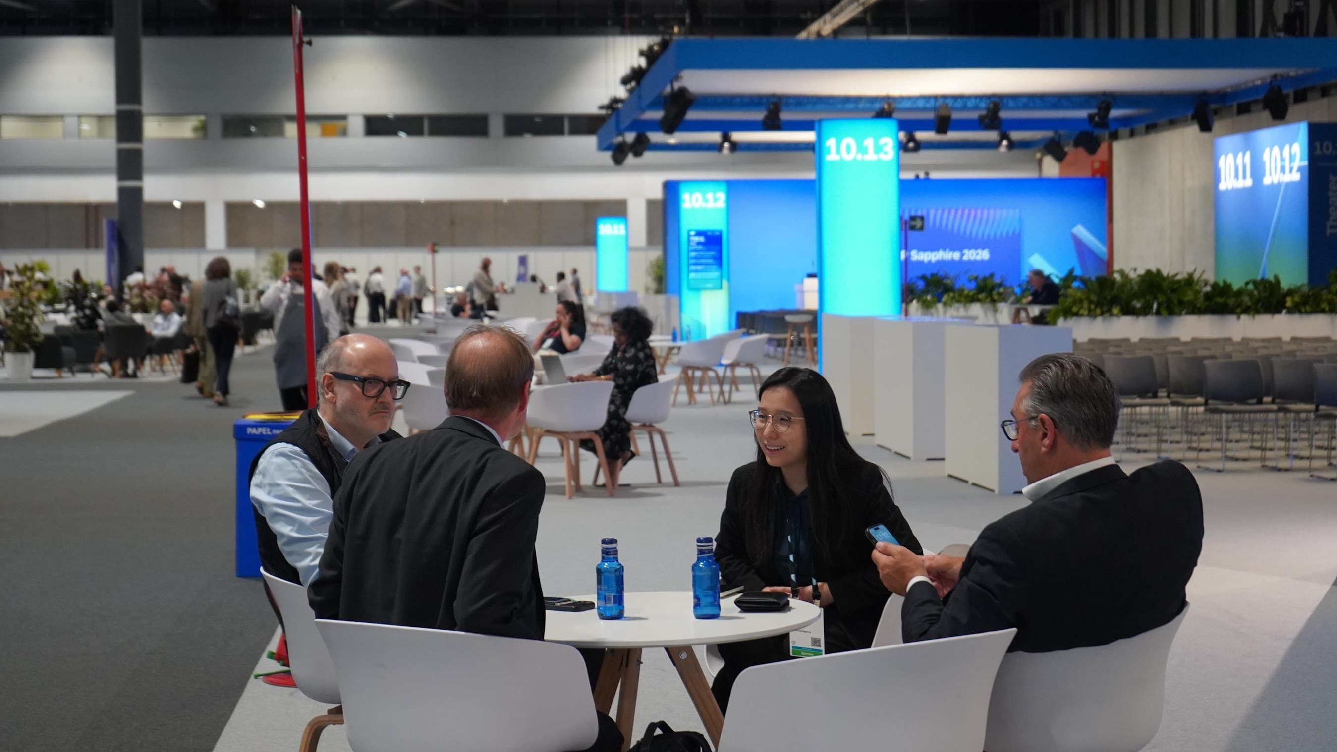 Nova team members meeting with attendees on the SAP Sapphire conference floor